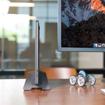 Bookarc for Macbook, Space-Saving Vertical Desktop Stand, Grey | Compact Laptop Stand for Comfortable Desktop Setup, Saves Space While Allowing Connection to Larger Display, Silicone Insert